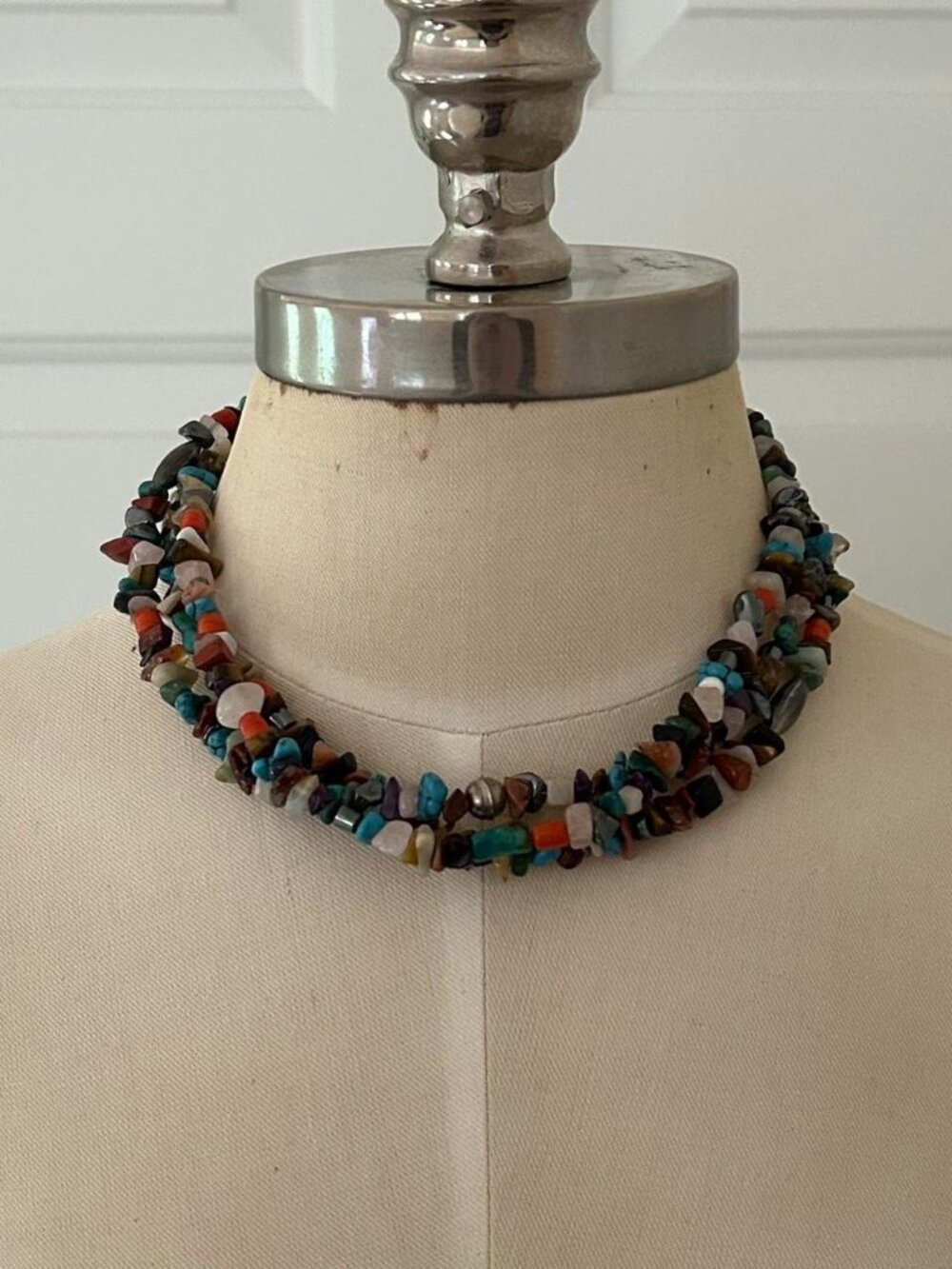 Multicoloured triple strand beaded gem necklace with silver clasp